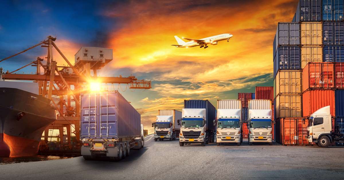 A scene of the shipping and transportation industry depicts cargo freight ships, freight trucks, and airplanes.